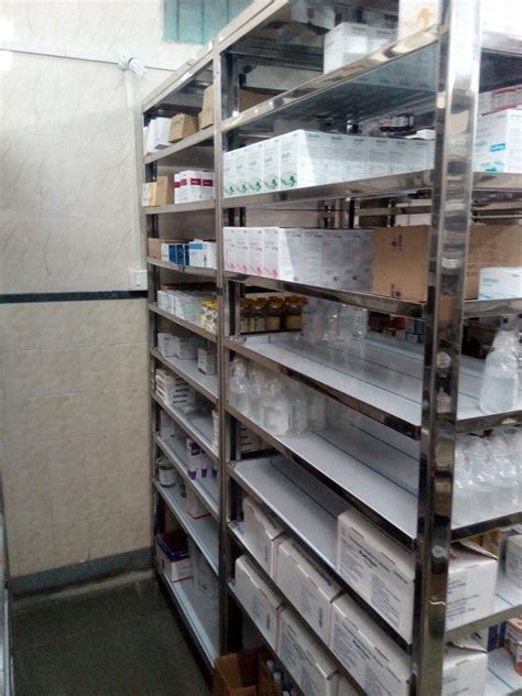 stainless steel pharmacy cabinet|pharmacy dispensing shelves.